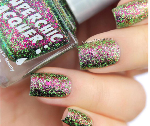 Sweet Surrender Nail Polish, close-up of a person's fingernails painted with multicolored glitter nail polish in pink, green, and black shades.