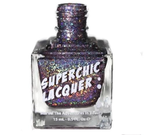 She Wears The Pants Nail Polish, glittery purple and multicolored nail polish in a clear bottle with the label 'Superchic Lacquer'.