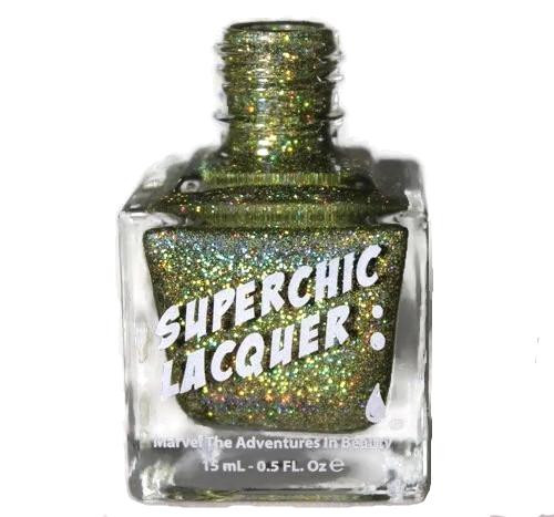 Boots On The Ground Nail Polish, glittery gold nail polish in a clear bottle with a gold cap and label reading 'Superchic Lacquer'.