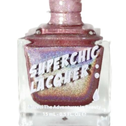 Rosebuddy Nail Polish, a pink glittery nail polish bottle with the label 'SuperChic Lacquer' and holographic effects on the bottle.