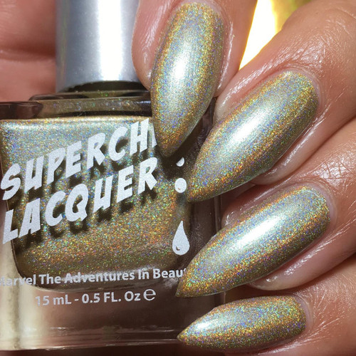 Wonderwall Nail Polish, holographic shimmering nail polish with a multi-color rainbow effect on well-manicured nails.