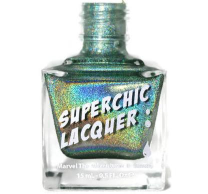Dirty Laundry Nail Polish, holographic teal glitter nail lacquer in a clear bottle with a silver cap.