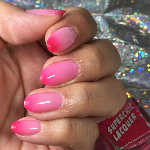 Naughty Thermal Nail Polish, pink nail polish with a gradient effect transitioning from light pink to darker pink.