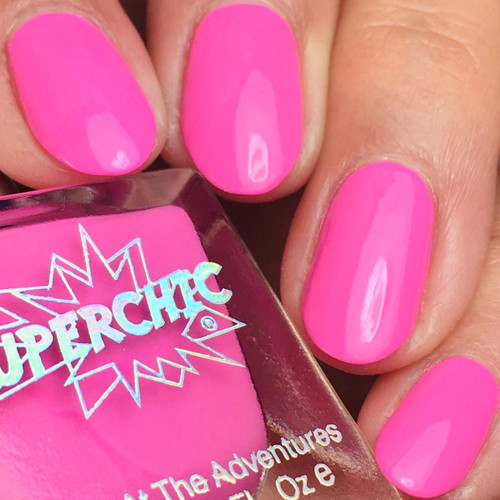 Sugar Coated Nail Polish, vibrant pink nail polish on fingers with a shiny finish.