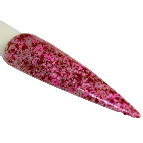 Love Language Nail Polish, close-up of a glittery pink nail polish with red, gold, and pink sparkles on a nail extension.
