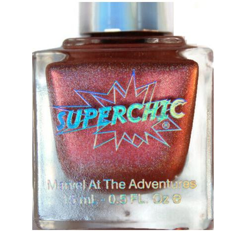 Aunt Clara Nail Polish, a shimmering metallic copper nail polish bottle with a silver cap, labeled 'Superchic' with a comic book style design.