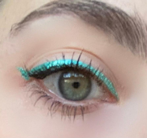 Sweet Winks Liquid Foil Effects Eyeliner, eye with turquoise metallic eyeliner applied on upper eyelid.
