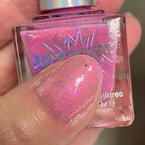 Ding Dong Pink Jelly Nail Polish - Inside Out Emotions Themed Nail Paint, pink jelly nail polish with holographic glitter, applied on a fingernail.