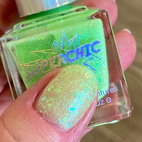 Icky Green Jelly Nail Polish - Inside Out Emotions Themed Nail Paint, close-up of vibrant green holographic nail polish on fingernail.