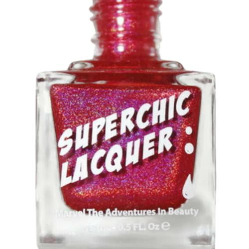 Realm Of Erotica Nail Polish, a vibrant red glitter nail polish in a clear glass bottle with bold white and purple label reading 'Superchic Lacquer' and a small white drop icon.