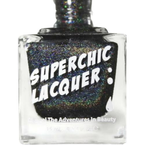 R.E.M. Holographic Black Nail Polish, holographic black nail polish in a clear square bottle with a black cap and bold white text