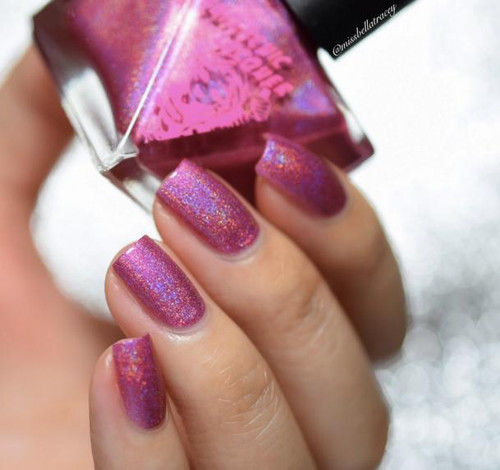 Hot Finger Nail Polish, close-up of manicured fingernails painted with pink holographic nail polish