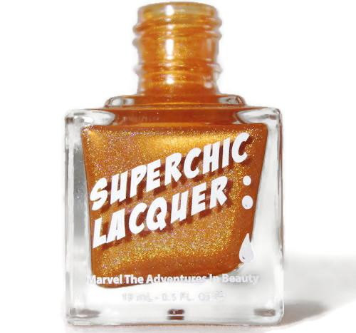 Reverse Polarity Nail Polish, golden shiny nail lacquer in a clear square bottle with a gold cap and white text on the front.