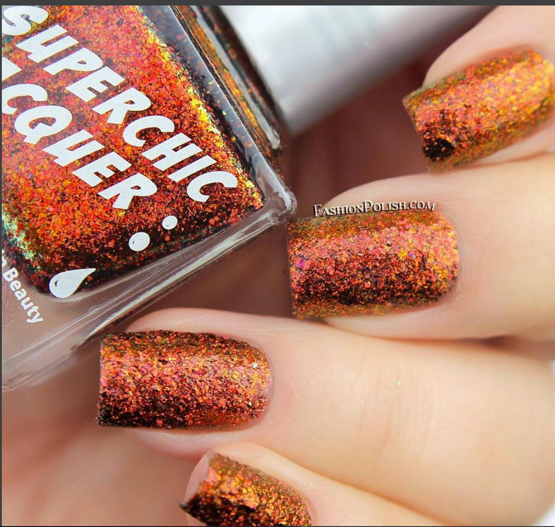 Crown Of Thorns Nail Polish, multicolored glitter-packed nail polish on fingernails.
