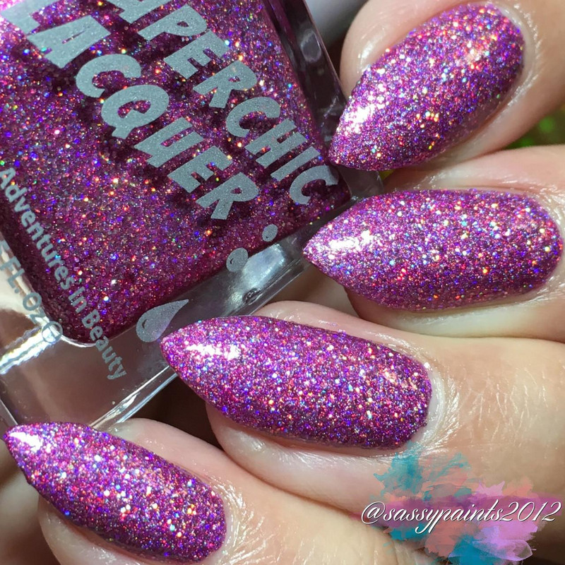 Material Girl Nail Polish, sparkling multi-colored glitter nail polish on manicured nails.