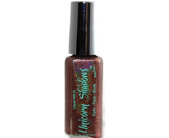 Ruler Holographic Eyeshadow, holographic glitter eyeshadow in a small bottle with a silver cap.