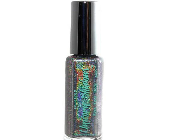 Cotton Candy Creature Holographic Eyeshadow, a glittery holographic eyeshadow in a clear bottle with colorful rainbow shimmer and holographic effects.