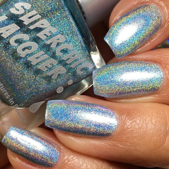 Outbreak Sky Blue Nail Polish, holographic metallic nail polish on fingernails with holographic light-reflecting finish.