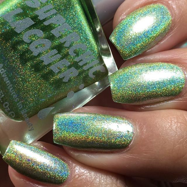 Germaphobe Nail Polish, close-up of holographic green nail polish applied on nails with shimmering effect.