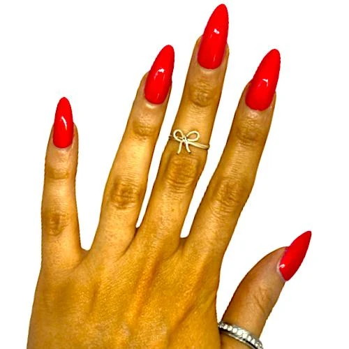 Cherry Bomb Neon Shimmer Nail Polish, vibrant red nail polish on a woman's hand with gold rings.