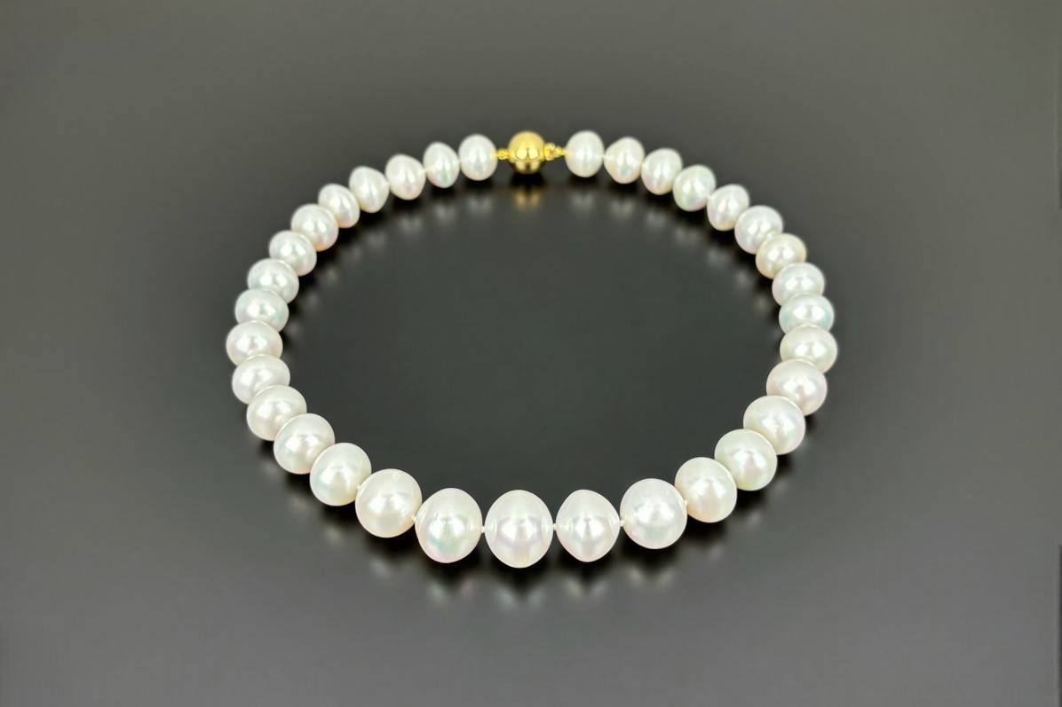 A Sumptuous Strand of South Sea Button Pearl Necklace.