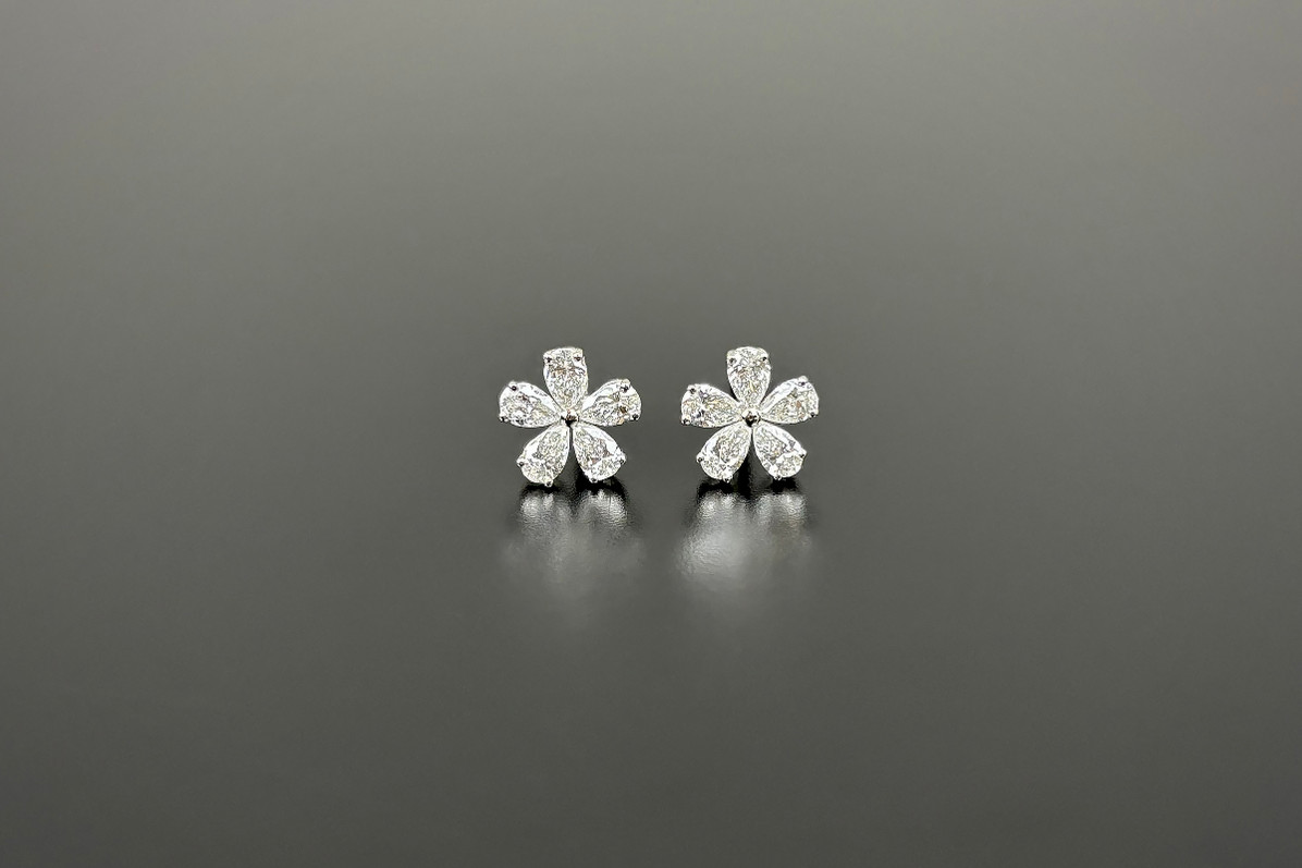 Pear cut diamond flower earrings in 18ct white  gold.