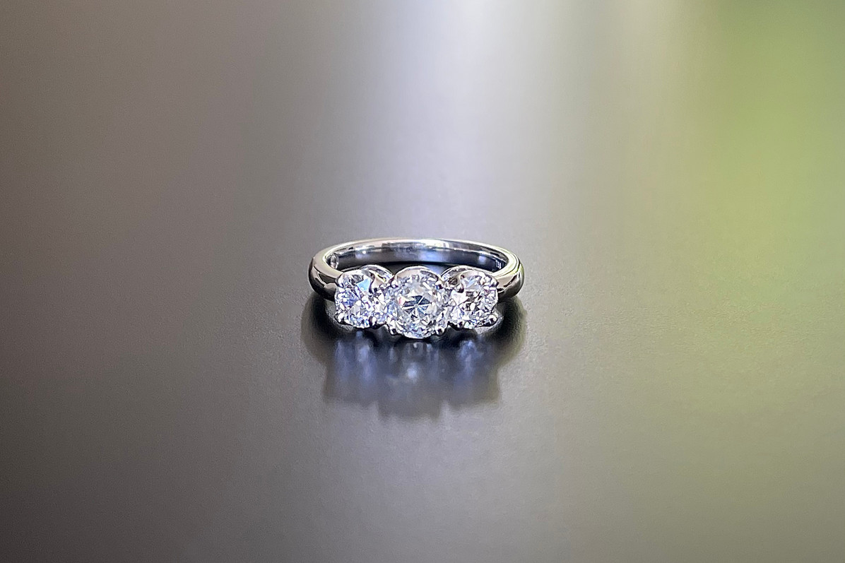 A Classic Diamond Trilogy Ring in 18k white gold
