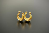 stylised hoop earrings silver gilt.