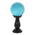 This small, teal blue crystal ball is not only a powerful tool in fortune telling and scrying, but also makes an eye-catching piece of décor. Whether used for divination or a table accessory at Halloween, this crystal ball is sure to be a conversation piece. Comes on black wooden stand. Keep out of direct sunlight. To preserve coloured coating, wipe clean with a soft dry cloth.