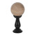 This small, smoky grey crystal ball is not only a powerful tool in fortune telling and scrying, but also makes an eye-catching piece of décor. Whether used for divination or a table accessory at Halloween, this crystal ball is sure to be a conversation piece. Comes on black wooden stand. Keep out of direct sunlight. To preserve coloured coating, wipe clean with a soft dry cloth.