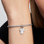 Modelo luciendo el Charm Colgante Pandora Grabable Camiseta Fútbol de plata de ley en su muñeca - 794708C01