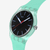 Vista lateral en primer plano del Reloj Swatch Hint of Mint con esfera negra y caja verde - SO29L103