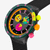 Vista lateral en primer plano del Reloj Swatch Swatch Neon Seppia SB02B104 con detalles multicolores y caja negra - SB02B104
