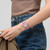 Modelo luciendo el Reloj Swatch Pink Petal Promise con esfera rosa y brazalete de piel en vista de muñeca - YLS234