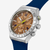 Vista lateral del Reloj Swatch Sidereal Glow con brazalete de goma azul y esfera marrón - YVS534