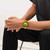 Modelo luciendo el Reloj Swatch Swatch Neon Signal Flag con brazalete de silicona naranja y esfera multicolor en vista lateral - SUSB422