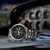 Vista lateral del Reloj Hamilton Khaki Aviation X-Wind GMT Chrono Quartz con brazalete de acero y esfera negra - H77912135