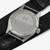 Vista trasera del Khaki Field Quartz 38 mm con esfera negra y brazalete de textil - H69401430