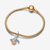 Pulsera Pandora con cordón en tono dorado y charm colgante Triple Celestial con elementos bañados en oro de 14k - 762676C01