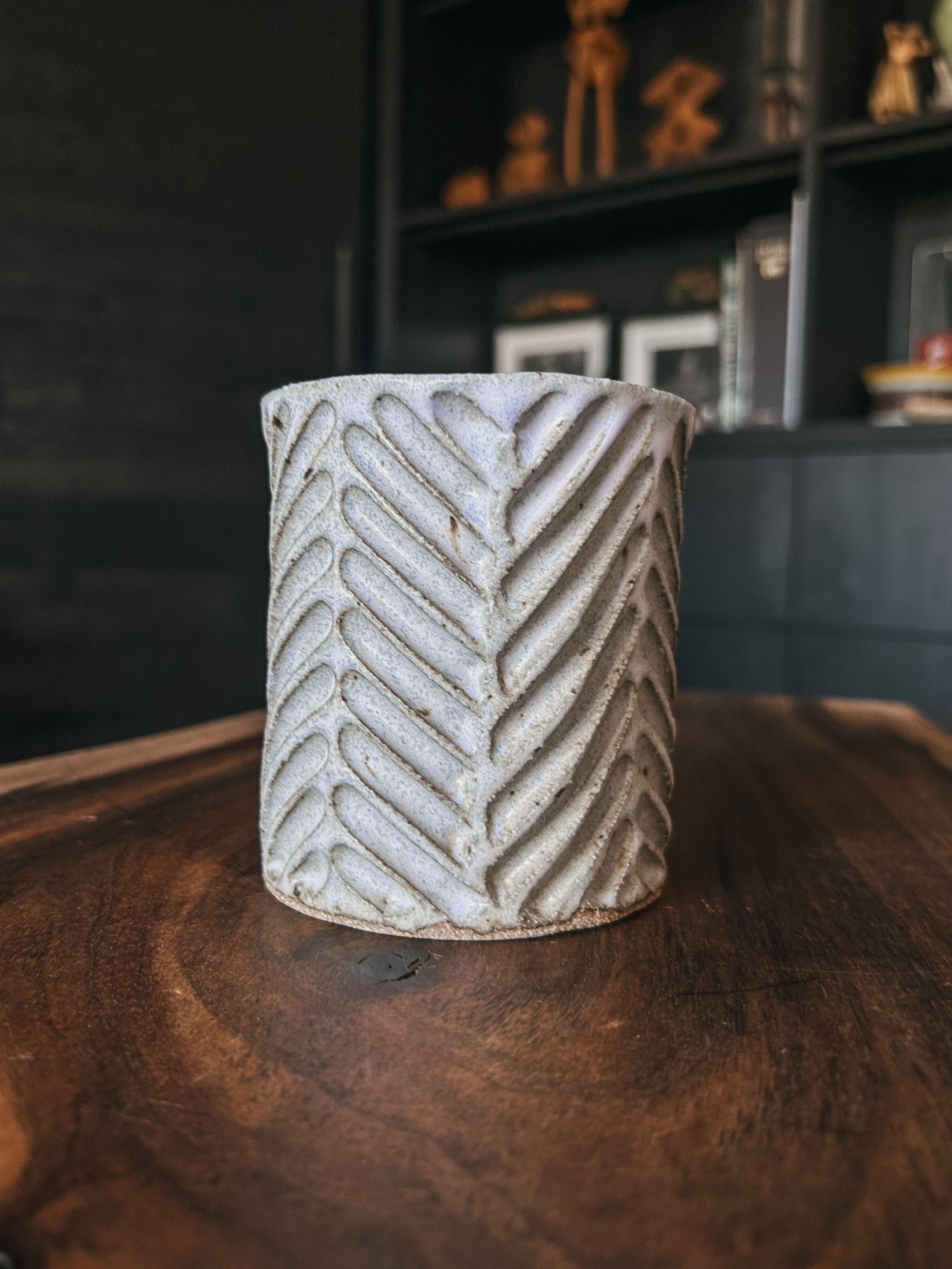 A porcelain, facet carved mug with a creamy lavender glaze. Holds 16 oz. of your favorite beverage.