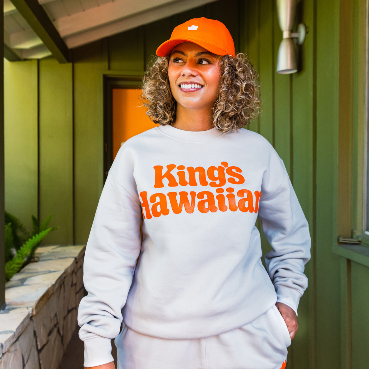 Lifestyle image of King's Hawaiian beige crewneck with puff print logo graphic, front Lifestyle image of King's Hawaiian beige crewneck with puff print logo graphic, front