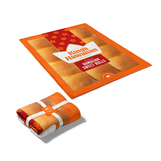 Image of King's Hawaiian Sherpa Blanket opened up next to blanket folded and wrapped