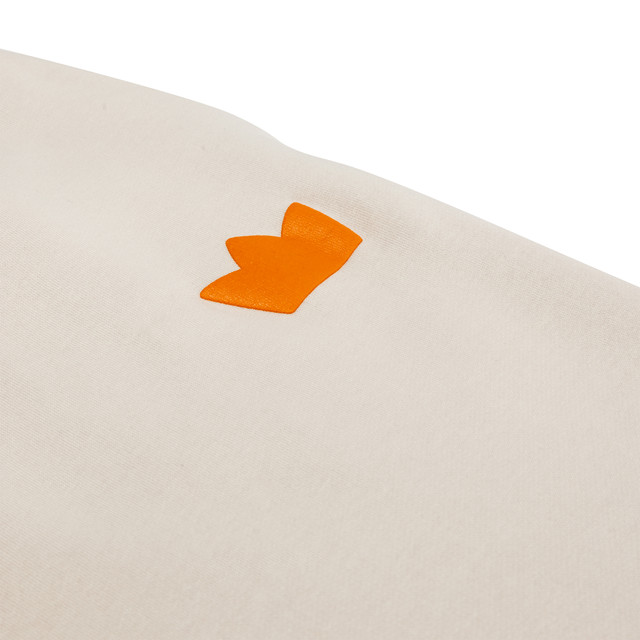 King's Hawaiian beige jogger with puff print crown logo near the pocket, close up King's Hawaiian beige jogger with puff print crown logo near the pocket, close up