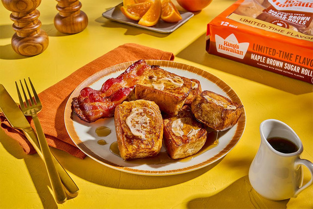 Pumpkin spice French toast made with King's Hawaiian Maple Brown Sugar Rolls, topped with whipped butter, syrup, and bacon