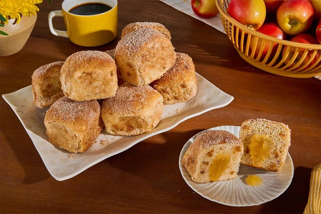 Brown Betty apple pie donuts made with cinnamon sugar coated King's Hawaiian Maple Brown Sugar Rolls filled with apple pie filling