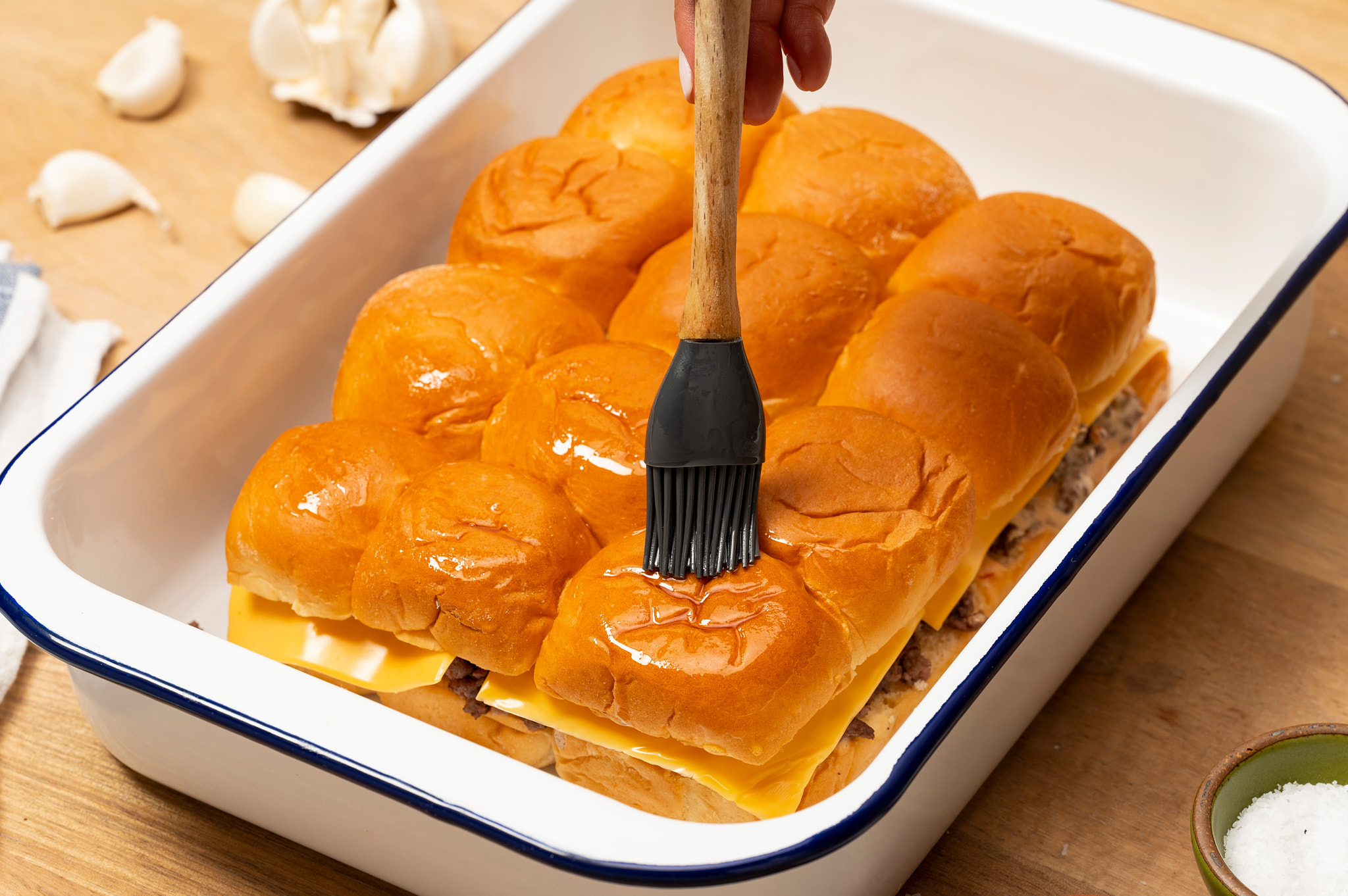 Brush butter over top of Mini Baked Cheeseburgers