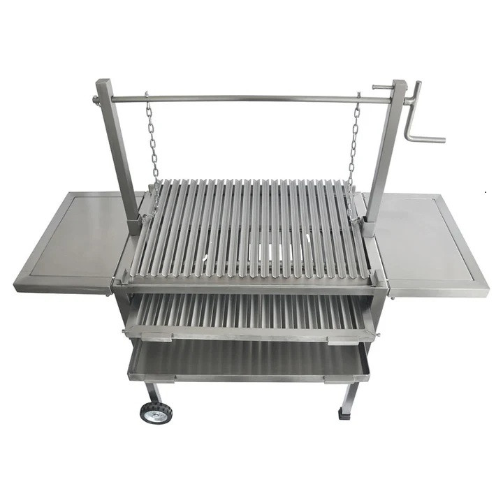 Front view of a stainless steel Argentine Parrilla featuring an adjustable V-grate cooking surface, dual side prep tables, and a lower storage shelf.