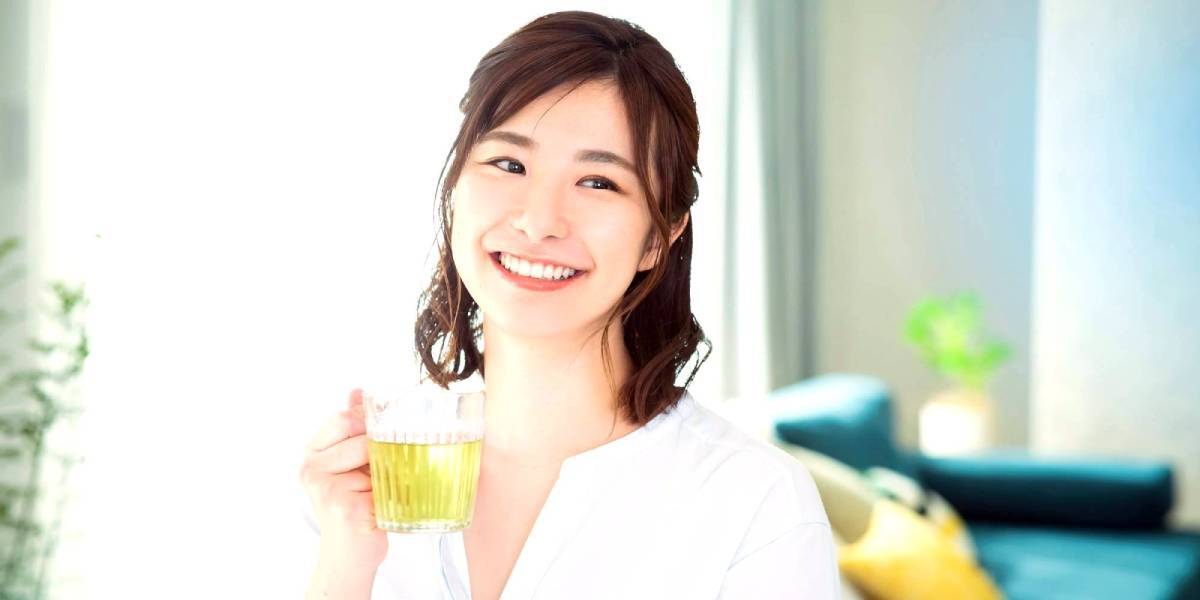Japanese woman drinking herbal tea in a traditional Japanese-style room