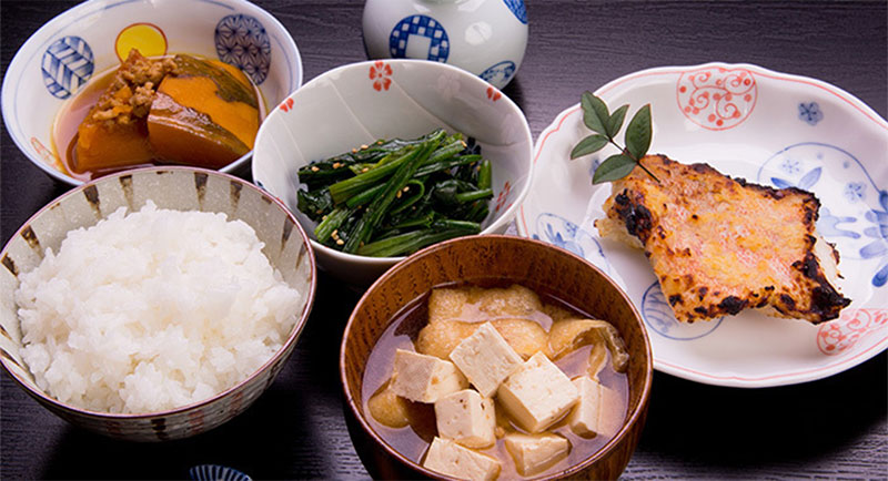 Typical Japanese meal includes a soup, three different dishes, and a bowl of rice