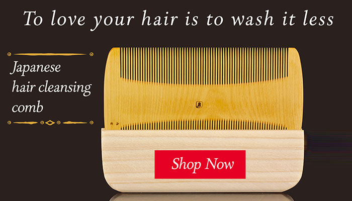 Japanese hair cleansing tsuge wood comb on black background
